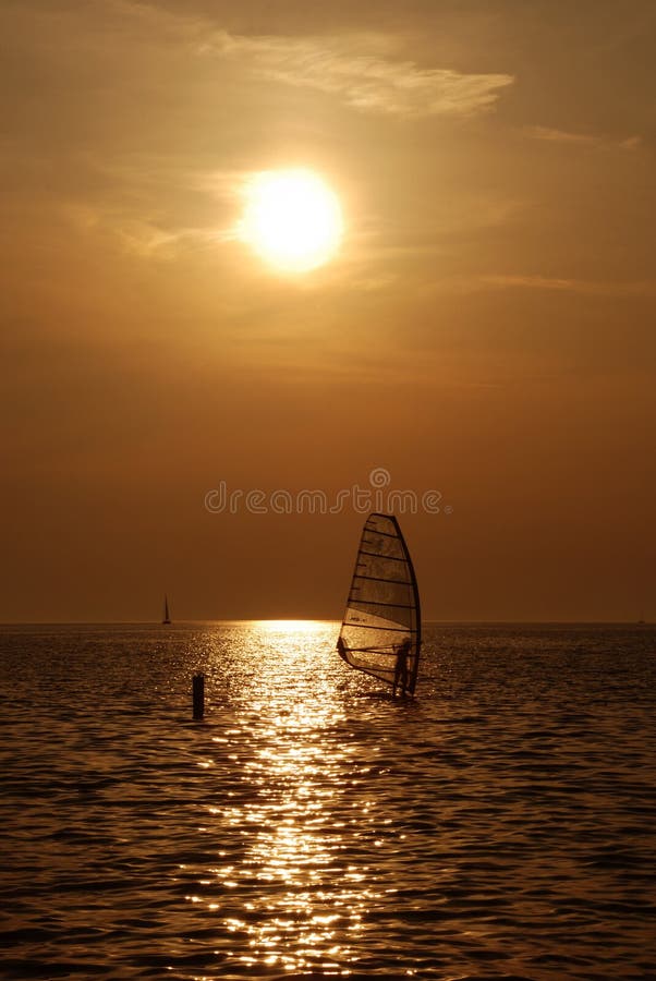 Windsurf sunset stock photo Windsurf sunset stock photo