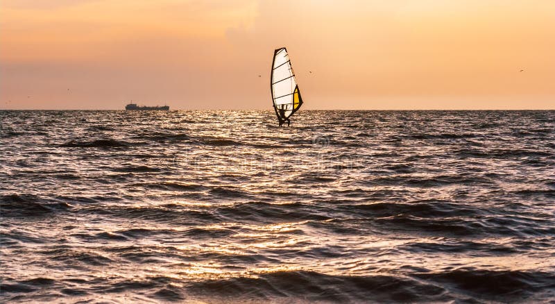 Windsurfing in the sea before the storm