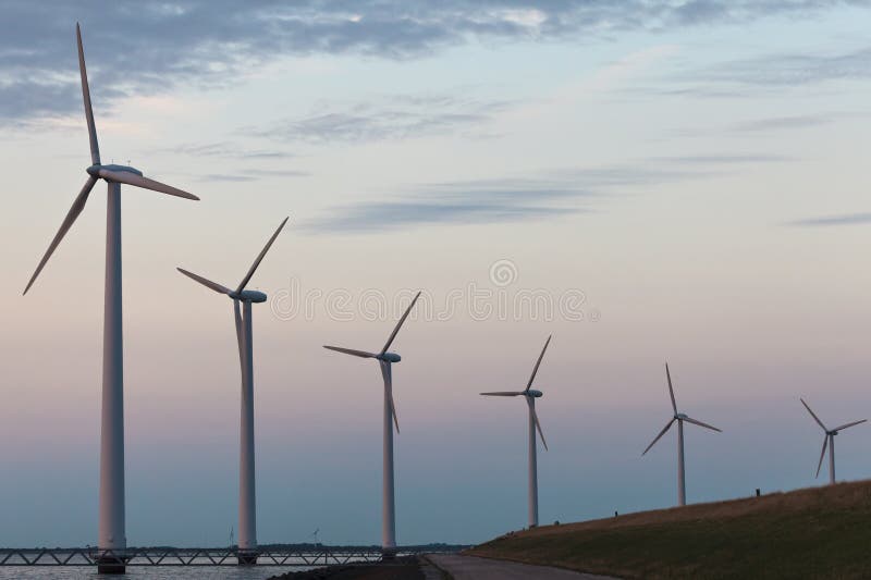Windturbine park in the Dutch Markermeer lake during sunset