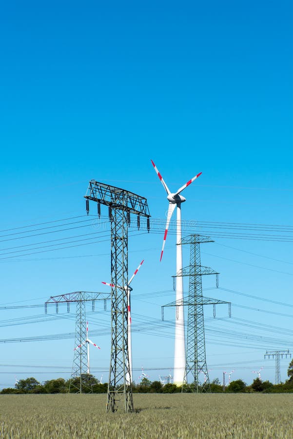 Windwheels and Power Transmission Lines in Germany Stock Photo Image