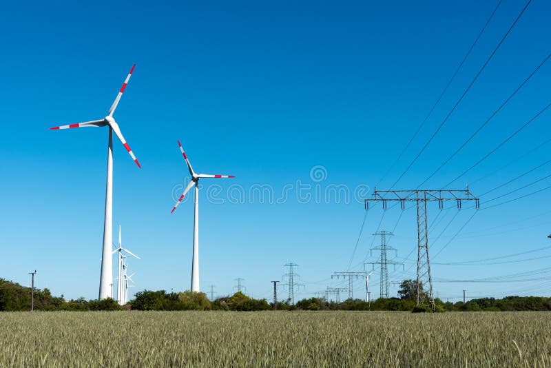 Windwheels and Power Transmission Lines in Germany Stock Image Image