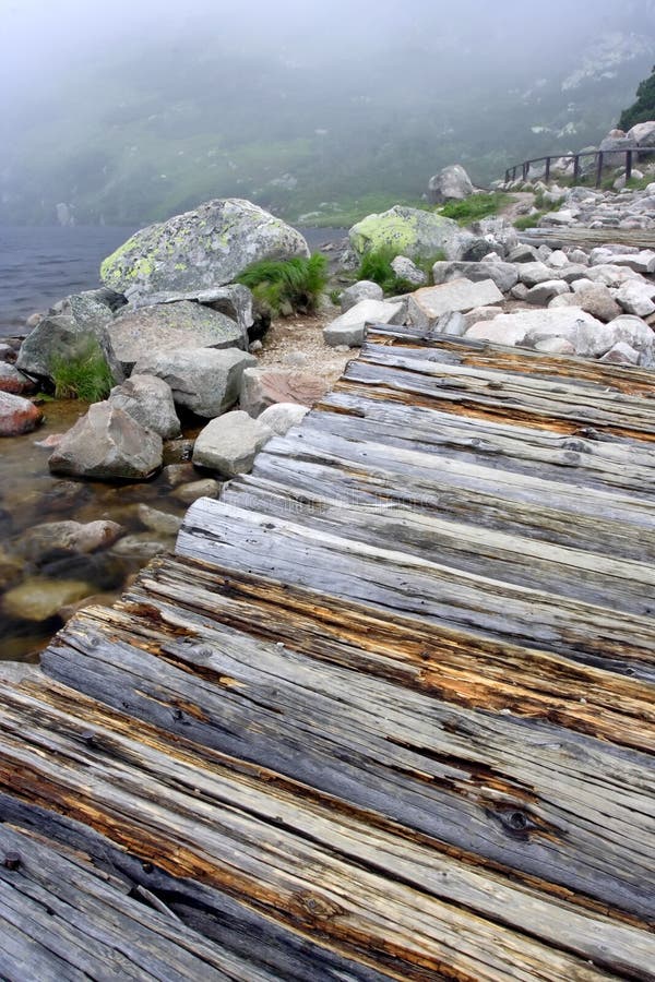 Windy foggy morning at lake