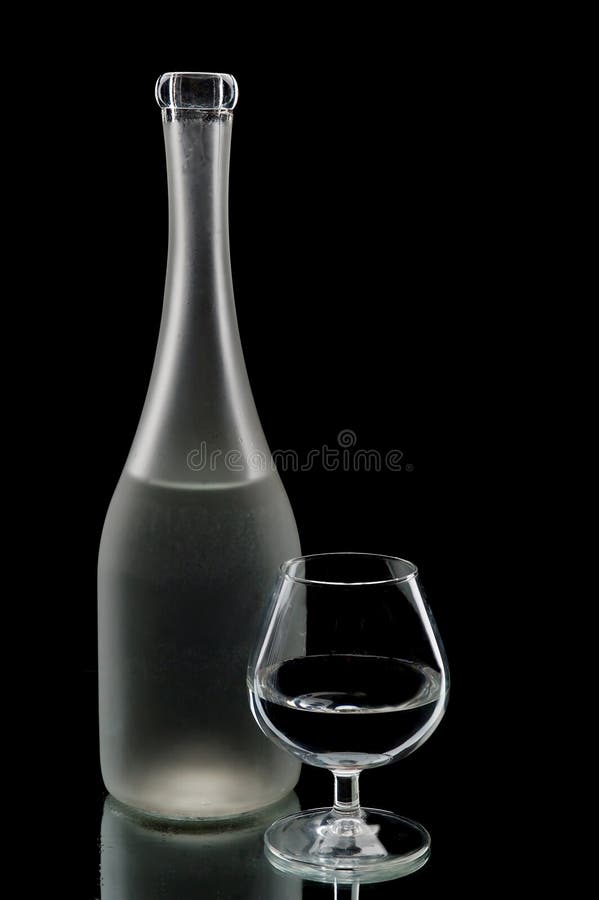 Old rum bottle and glass stock image. Image of alcoholism 5109017