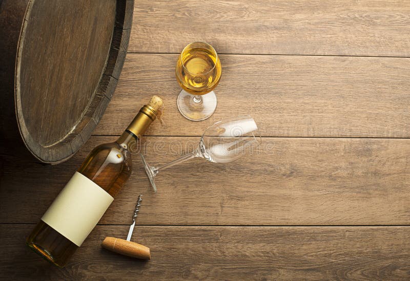 Wine bootle and glass on wooden table stock photos