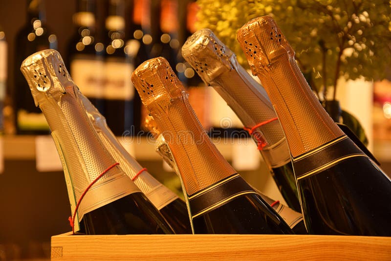 Wine bottles on a shelf in a supermarket stock photo Wine bottles on a shelf in a supermarket stock photo