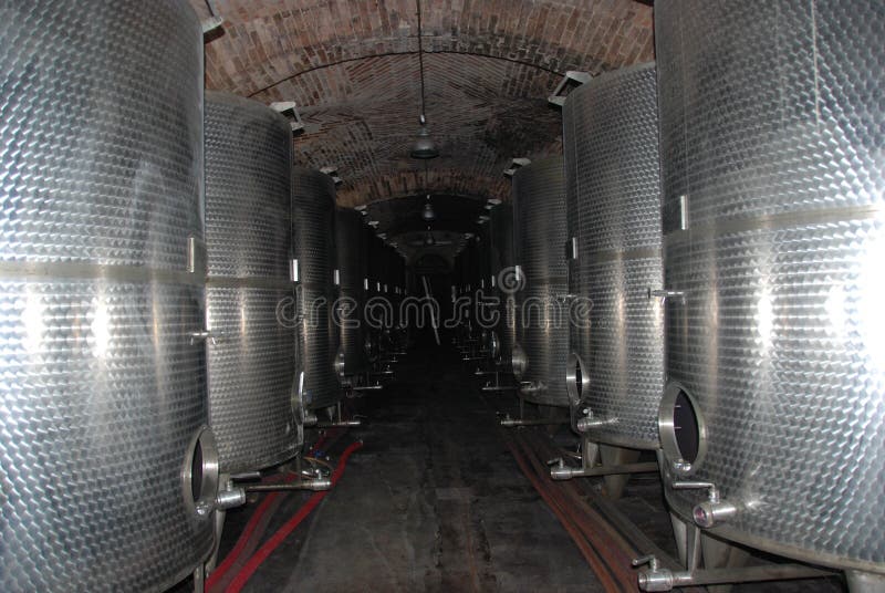 Barrels in a wine cellar stock image. Image of cellar 99852571