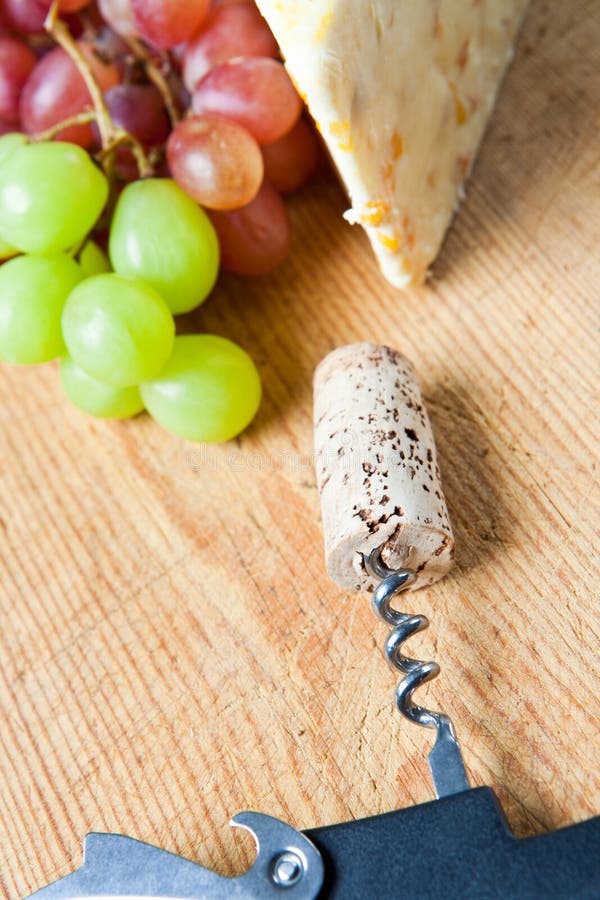 Wine cork with grapes and cheese