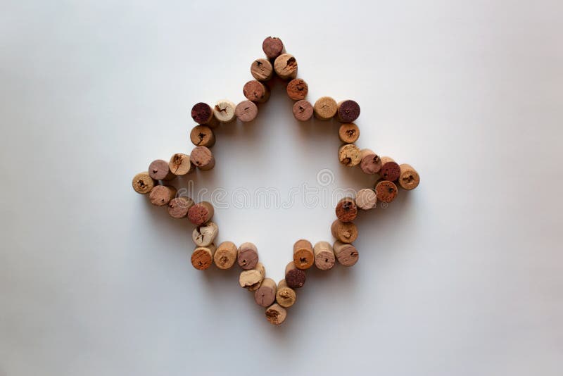 Wine corks octagram star on white background royalty free stock photography