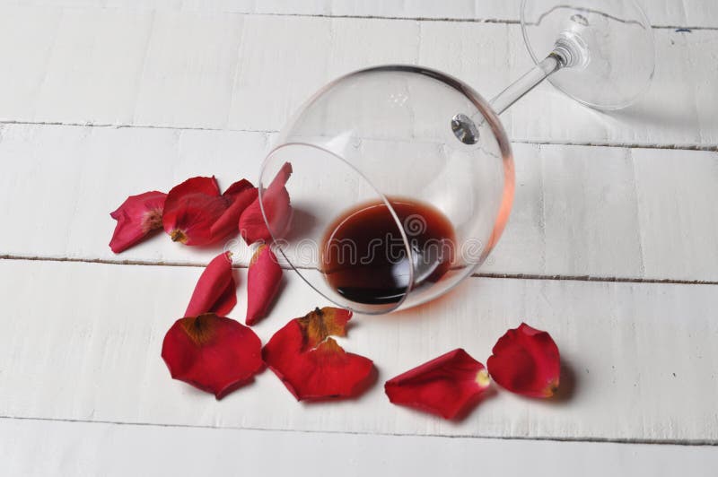 Wine glass and beautiful red rose isolated on white background. petals rose.Copy space stock photography Wine glass and beautiful red rose isolated on white background. petals rose.Copy space stock photography