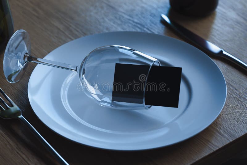 Wine glass with blank business card inside on white dish plate. 3d rendering. stock illustration Wine glass with blank business card inside on white dish plate. 3d rendering. stock illustration