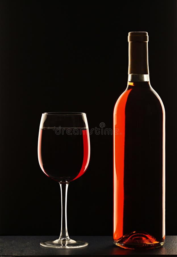 Wine glass and bottle of red wine