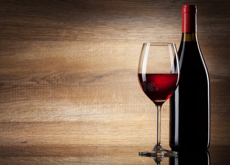 Wine glass and Bottle on a wooden background