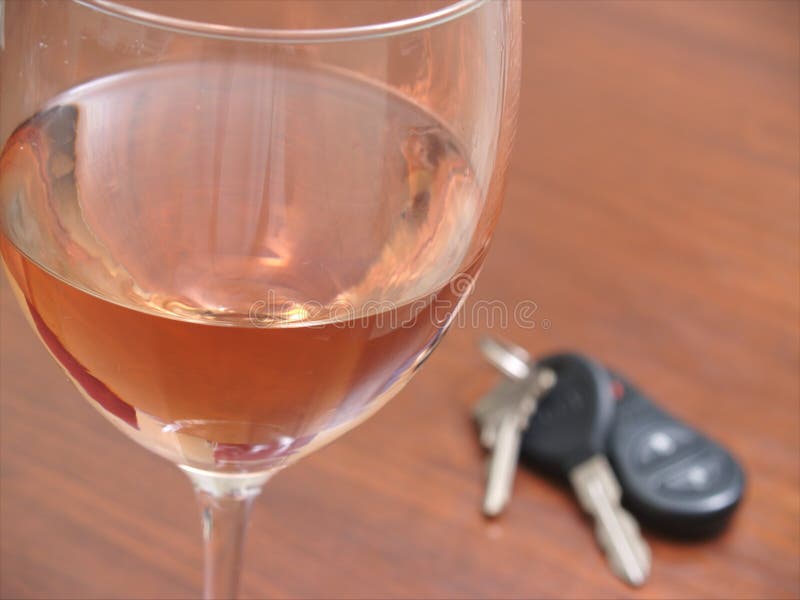 A wine glass with car keys stock photo. Image of crime 110305550