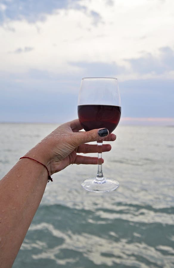 Wine Glasses with Red Wine on the Beach at Sunset. Stock Photo - Image ...