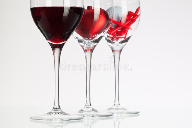 Wine Glasses with Red Wine, Heart and Golf Ball Stock Image Image of