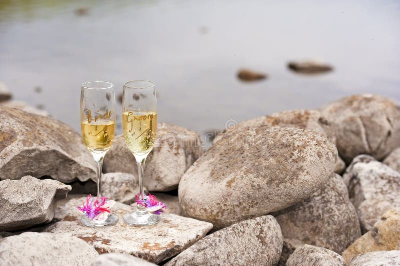 wine glasses on rocky beach