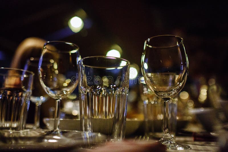Wine glasses and table setting in restaurant royalty free stock photo Wine glasses and table setting in restaurant royalty free stock photo