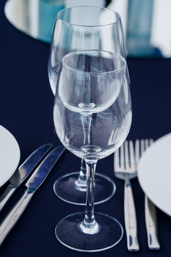 Wine Glasses with Tableware Arranged on Tablecloth for Reception or