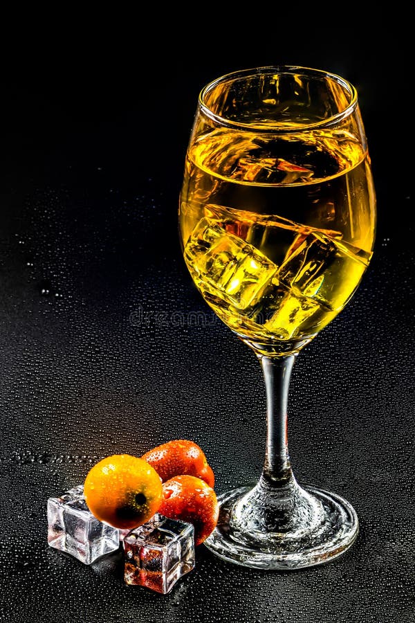 Wine, ice cubes and fruit stock image. Image of beverages 194208217