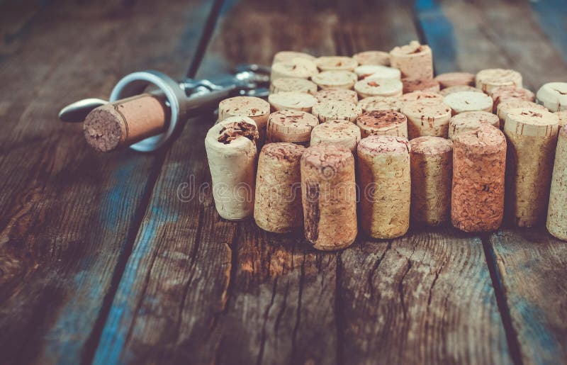 Wine making background with corkscrew and corks stock images
