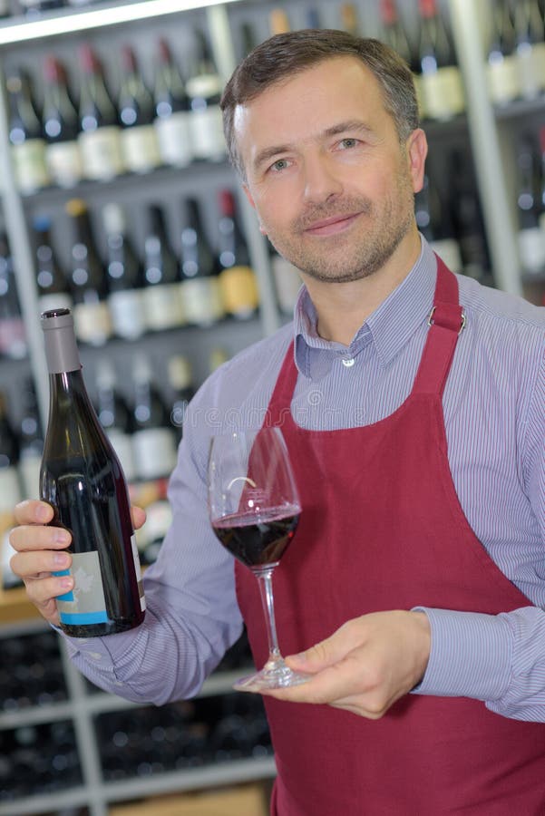 Wine Merchant Showing Bottle and Glass Wine Stock Photo Image of salesperson, seller 84786848
