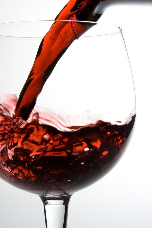 Wine pouring into glass stock images
