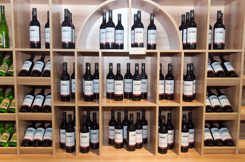 Wine shelves in shop editorial photography. Image of rows 26349597