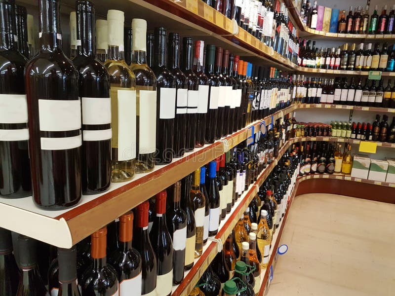 Wine store drinks bottles on shelf royalty free stock photo Wine store drinks bottles on shelf royalty free stock photo