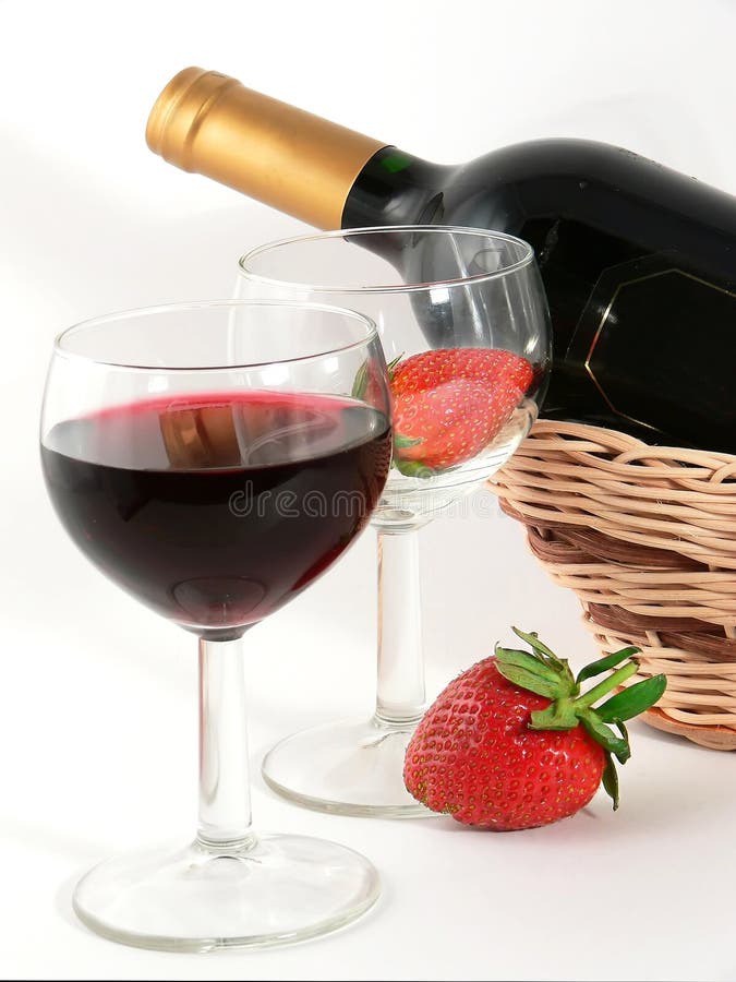 Wineglass with red wine and strawberry