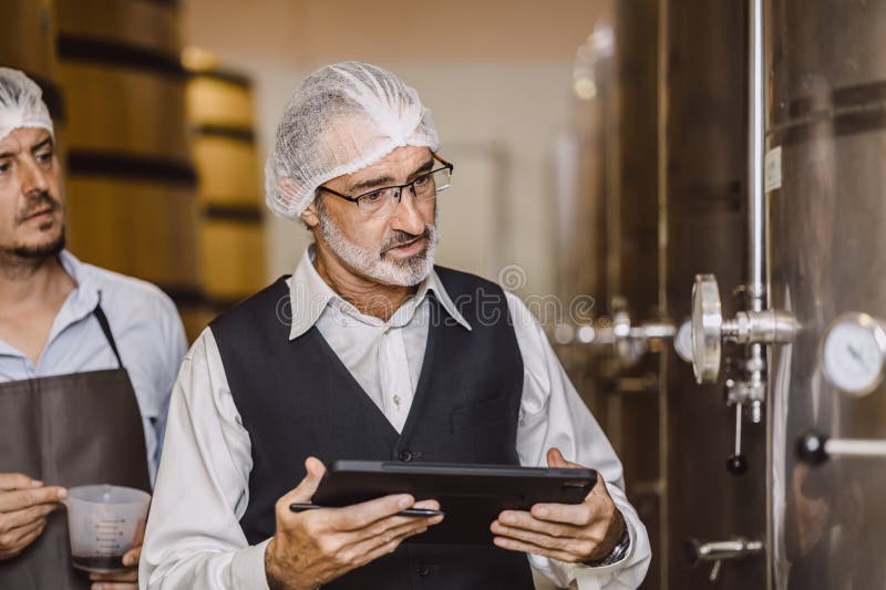Winemaker Professional Working in Modern Large Winery Factory Liquor