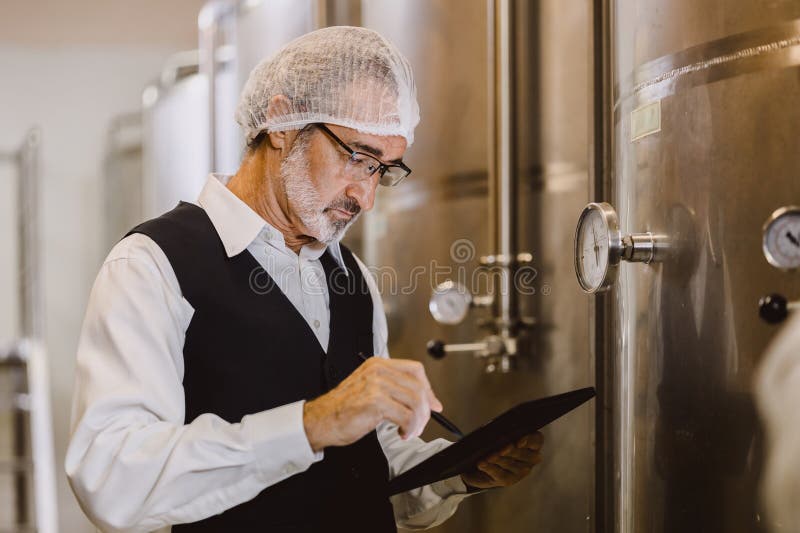 Winemaker Professional Working in Modern Large Winery Factory Liquor