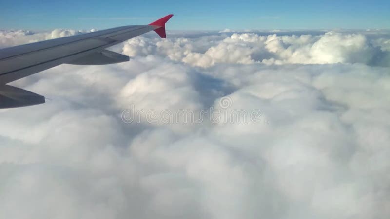 Wing of plane and cloud at decrease. Frankfurt am Main, Germany; 2018-11-02. Decrease video