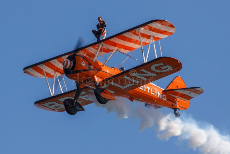 Breitling Wing-Walkers aeronautics team at an airshow show off their skills. Breitling Wing-Walkers aeronautics team at an airshow show off their skills