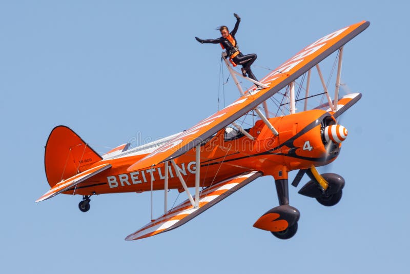 Breitling Wing-Walkers aeronautics team at an airshow show off their skills. Breitling Wing-Walkers aeronautics team at an airshow show off their skills