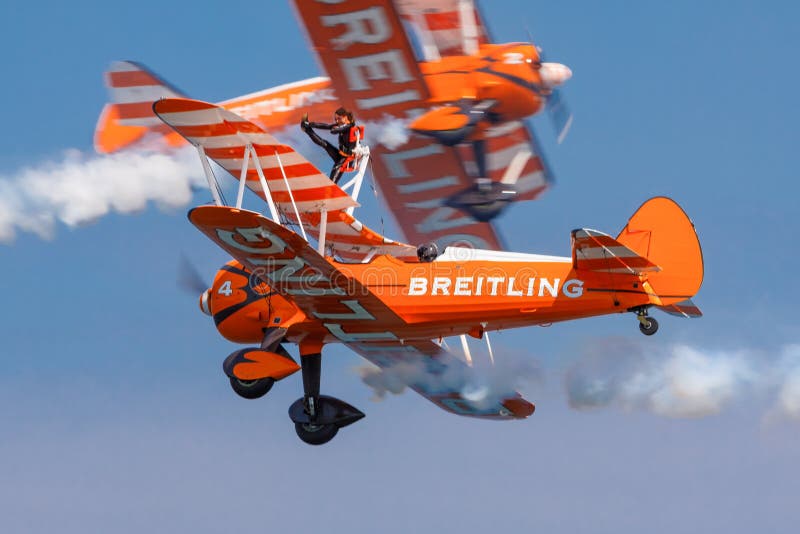 Breitling Wing-Walkers aeronautics team at an airshow show off their skills. Breitling Wing-Walkers aeronautics team at an airshow show off their skills