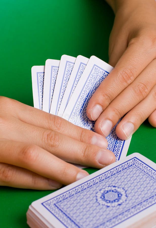 Cards and money on a green cloth. Cards and money on a green cloth