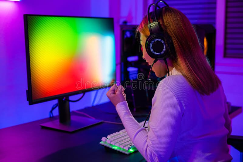 Premium Photo  Asian man playing game on mobile phone professional gamer  playing video games on personal pc computer colorful neon light room esport online  game