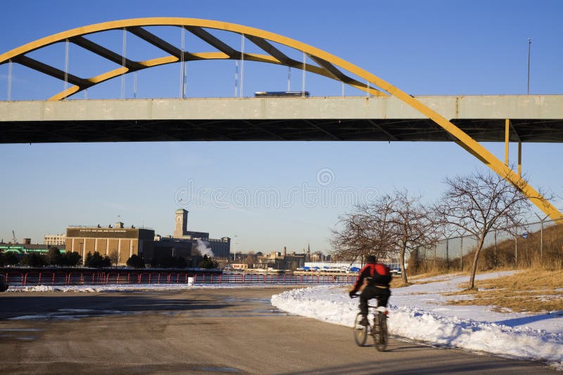 Winter biking in Milwaukee editorial photography. Image of michigan
