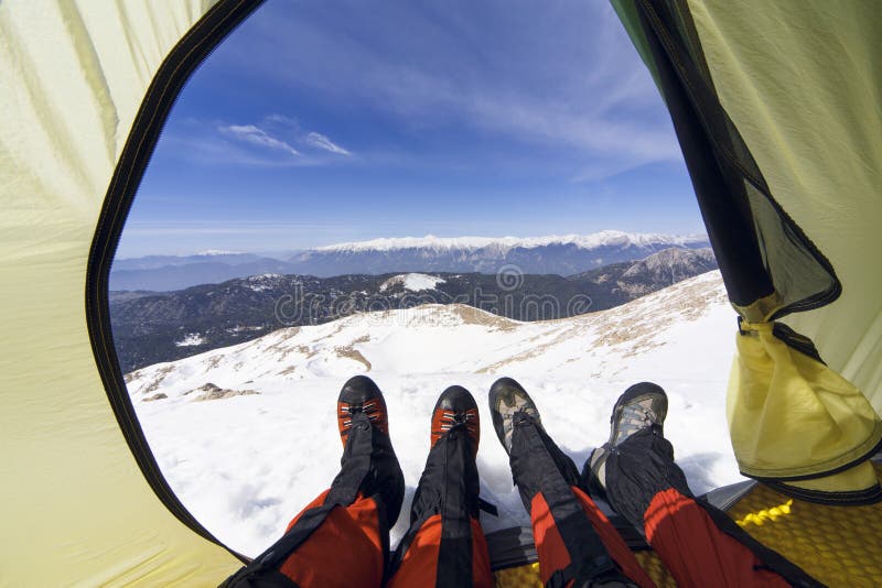 Winter Camping in the Mountains with a Backpack and Tent. Stock Photo