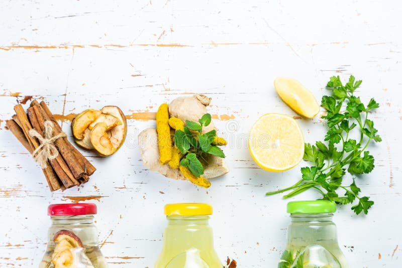 Winter detox drinks - drinking vinegars. With cinnamon, ginger and lemon stock image