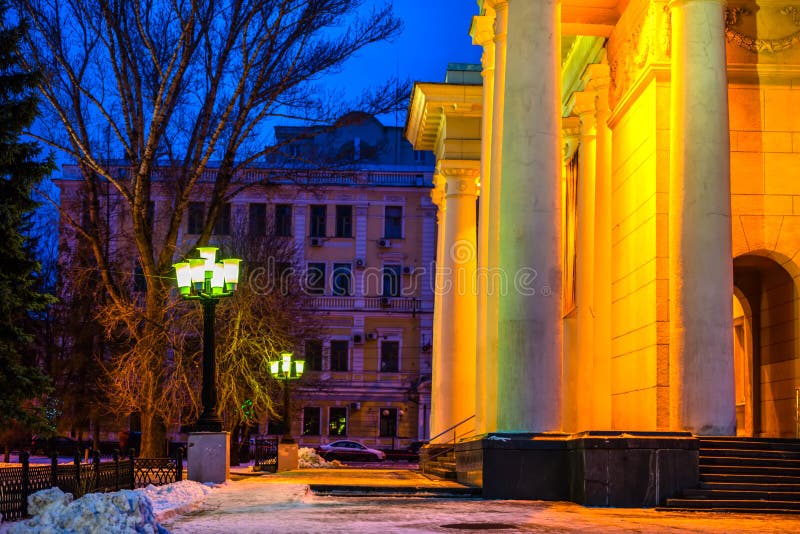 Winter evening city of Saratov with colonnade Academic Theater O