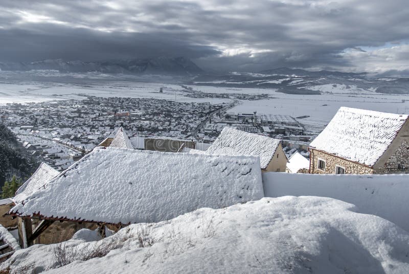 Winter fairy tale small village Rasnov in Romania stock photography Winter fairy tale small village Rasnov in Romania stock photography