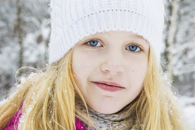 In Winter, in the Forest, There is a Beautiful Little Girl in a Stock ...