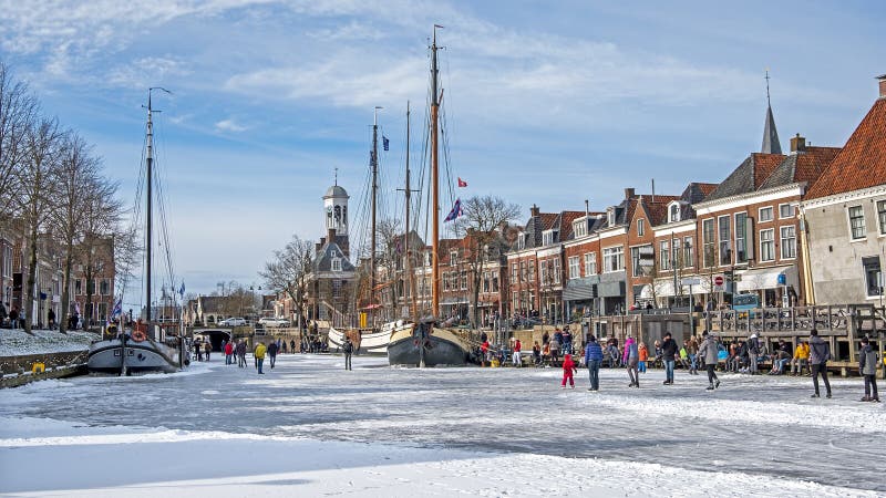 Winter fun on the canals in the city Dokkum in the Netherlands