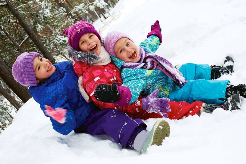 Winter fun, snow, children sledding at winter time stock photo Winter fun, snow, children sledding at winter time stock photo