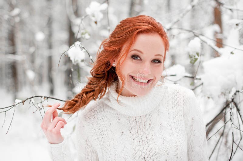 Winter girl portrait in december forest