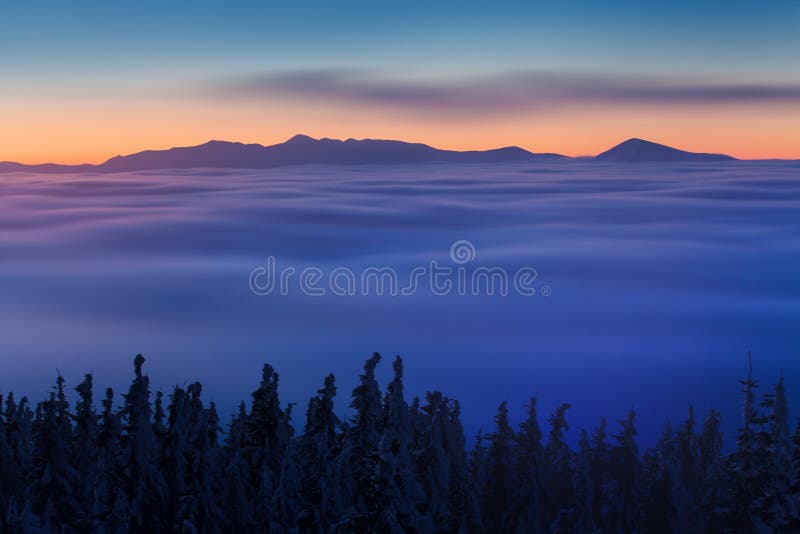 Winter High Tatras mountain range panorama with many peaks and clear sky. Sunny day on top of snowy mountains.