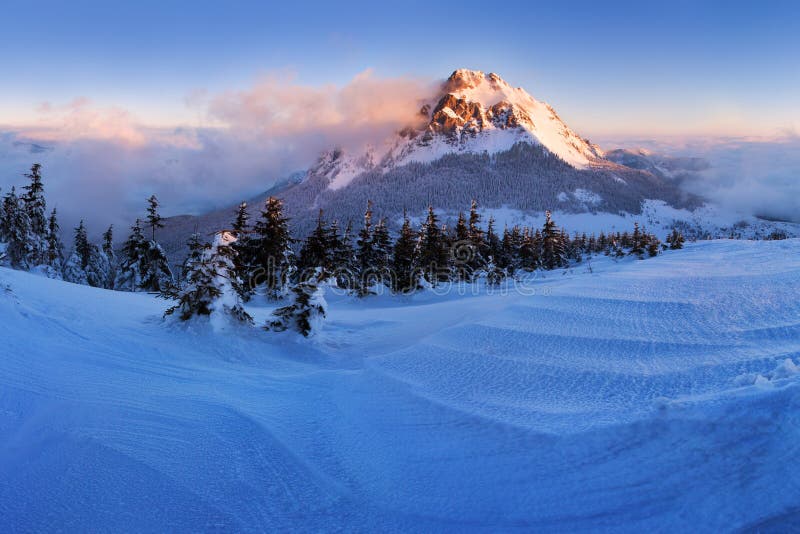 Winter High Tatras mountain range panorama with many peaks and clear sky. Sunny day on top of snowy mountains.