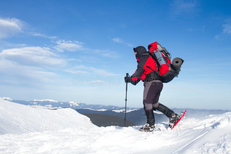 Winter hiking in the mountains on snowshoes with a backpack and tent. Winter trekking. Backpack snowshoeing stock images, royalty-free photos and pictures