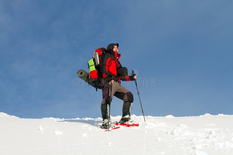 Winter hiking in the mountains on snowshoes with a backpack and tent. Winter trekking. Backpack snowshoeing stock images, royalty-free photos and pictures